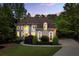 Charming two-story home with arched windows and a well-manicured front yard at 770 Pine Leaf Ct, Alpharetta, GA 30022