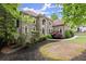 Beautiful two-story home with well-manicured landscaping and an inviting, curved walkway at 770 Pine Leaf Ct, Alpharetta, GA 30022