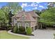 Stately home featuring an attached three-car garage and beautiful landscaping at 770 Pine Leaf Ct, Alpharetta, GA 30022