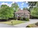Attractive home exterior featuring a lush green lawn and a winding driveway at 770 Pine Leaf Ct, Alpharetta, GA 30022