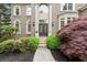 Elegant front entrance with a double door, stone steps, and lush landscaping at 770 Pine Leaf Ct, Alpharetta, GA 30022