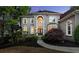 Well-maintained home featuring a manicured lawn, mature landscaping, and an inviting facade at 770 Pine Leaf Ct, Alpharetta, GA 30022