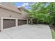 Spacious three-car garage with ample driveway parking and manicured landscaping at 770 Pine Leaf Ct, Alpharetta, GA 30022
