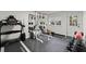 Home gym featuring a treadmill, weight rack, and bench for exercise at 770 Pine Leaf Ct, Alpharetta, GA 30022