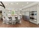 Modern kitchen featuring stainless steel appliances, a center island, and updated countertops at 770 Pine Leaf Ct, Alpharetta, GA 30022