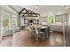 Open kitchen featuring a large island, stainless steel appliances, and hardwood floors at 770 Pine Leaf Ct, Alpharetta, GA 30022