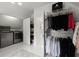 Laundry room features washer and dryer, clothing racks and carpet at 770 Pine Leaf Ct, Alpharetta, GA 30022