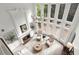 Spacious living room showcasing a soaring ceiling, fireplace, and elegant chandelier at 770 Pine Leaf Ct, Alpharetta, GA 30022