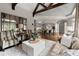 Open concept living room and kitchen area featuring hardwood floors and gray cabinets at 770 Pine Leaf Ct, Alpharetta, GA 30022