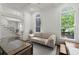 Cozy living room with large arched windows and elegant trim at 770 Pine Leaf Ct, Alpharetta, GA 30022