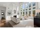 Bright living room with high ceilings, fireplace, and large windows offering plenty of natural light at 770 Pine Leaf Ct, Alpharetta, GA 30022