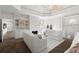 Bright main bedroom featuring a fireplace, seating area, and built-in bookshelves at 770 Pine Leaf Ct, Alpharetta, GA 30022