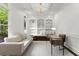 Stylish office with custom built-in shelves, window seat, and modern desk at 770 Pine Leaf Ct, Alpharetta, GA 30022