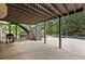 View of the patio with gas grills, outdoor fireplace, backyard, and stairs to an elevated outdoor deck at 770 Pine Leaf Ct, Alpharetta, GA 30022