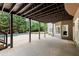 Covered patio offering backyard views of the pool and green landscaping, providing shade and outdoor living space at 770 Pine Leaf Ct, Alpharetta, GA 30022