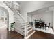 Staircase with wooden steps and white railings leading to the second floor, next to the dining room at 770 Pine Leaf Ct, Alpharetta, GA 30022