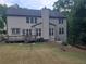 Back exterior featuring a deck, fenced-in yard and mature trees at 101 Brendylynn Trce, Woodstock, GA 30188