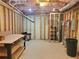 Unfinished basement space with exposed insulation, framing, and a workbench at 101 Brendylynn Trce, Woodstock, GA 30188
