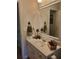 Clean and bright bathroom vanity with a large mirror and decorative accents at 101 Brendylynn Trce, Woodstock, GA 30188
