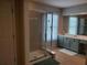 Bathroom featuring a glass enclosed shower, green cabinets, and tile floors at 101 Brendylynn Trce, Woodstock, GA 30188