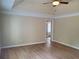 Bedroom with hardwood flooring, tray ceiling, and a neutral color palette at 101 Brendylynn Trce, Woodstock, GA 30188