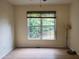 Bright bedroom with large window overlooking green backyard at 101 Brendylynn Trce, Woodstock, GA 30188