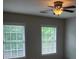This airy bedroom features two windows that offer plenty of natural light at 101 Brendylynn Trce, Woodstock, GA 30188