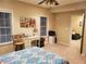 Carpeted bedroom offers a large window, desk, and doorway access to another furnished room at 101 Brendylynn Trce, Woodstock, GA 30188