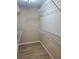 Walk-in closet with built-in shelving for optimized storage and organization at 101 Brendylynn Trce, Woodstock, GA 30188