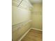 Well-organized walk-in closet with multiple shelves for optimal storage solutions at 101 Brendylynn Trce, Woodstock, GA 30188