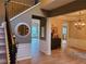 Elegant foyer with hardwood floors, staircase, and a decorative chandelier, creating a grand entrance at 101 Brendylynn Trce, Woodstock, GA 30188