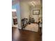 Hallway leading to a bathroom with wood-look floors and neutral paint at 101 Brendylynn Trce, Woodstock, GA 30188