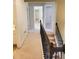 Hallway with natural light, neutral tones, and carpet, connecting rooms within the home at 101 Brendylynn Trce, Woodstock, GA 30188