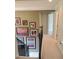 Hallway with decorative stairway, neutral tones, and artwork, provides a sense of warmth and sophistication at 101 Brendylynn Trce, Woodstock, GA 30188