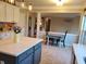 Bright, open kitchen with island seating and dining space bathed in natural light at 101 Brendylynn Trce, Woodstock, GA 30188