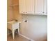 Functional laundry room with a utility sink and ample upper cabinet storage at 101 Brendylynn Trce, Woodstock, GA 30188