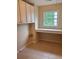 Well-equipped laundry room with a window, a counter, and upper cabinet storage at 101 Brendylynn Trce, Woodstock, GA 30188