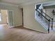 Open floor plan featuring hardwood floors and a staircase with iron railings at 101 Brendylynn Trce, Woodstock, GA 30188