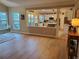Living room open to kitchen with light wood floors at 101 Brendylynn Trce, Woodstock, GA 30188