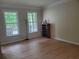 Spacious living room with hardwood floors and natural light streaming through the windows at 101 Brendylynn Trce, Woodstock, GA 30188