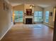 Bright living room features a fireplace, vaulted ceiling, and large windows overlooking the backyard at 101 Brendylynn Trce, Woodstock, GA 30188
