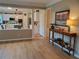 Inviting living room with view into updated kitchen featuring modern appliances and breakfast bar at 101 Brendylynn Trce, Woodstock, GA 30188