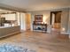 Inviting living room with view into updated kitchen featuring modern appliances and breakfast bar at 101 Brendylynn Trce, Woodstock, GA 30188