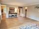 Open living room showcasing classic trim, hardwood floors, and seamless flow to other living areas at 101 Brendylynn Trce, Woodstock, GA 30188