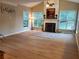 Bright living room features a fireplace, vaulted ceiling, and large windows overlooking the backyard at 101 Brendylynn Trce, Woodstock, GA 30188