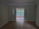 Office space with glass double doors, neutral walls, and hardwood floors at 101 Brendylynn Trce, Woodstock, GA 30188