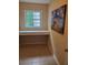 A cozy office nook featuring a window and a sunflower art piece at 101 Brendylynn Trce, Woodstock, GA 30188