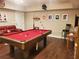 Basement rec room boasts a billiard table, wet bar, and comfortable leather seating at 101 Brendylynn Trce, Woodstock, GA 30188