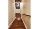 View of finished wood staircase with 'Personal Cave' sign overhead, and a decorative picture hanging on the wall at 101 Brendylynn Trce, Woodstock, GA 30188