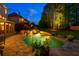 Outdoor oasis featuring a gunite pool and spa with a waterfall, lush landscaping, and stone surround at 2660 Pete Shaw Rd, Marietta, GA 30066